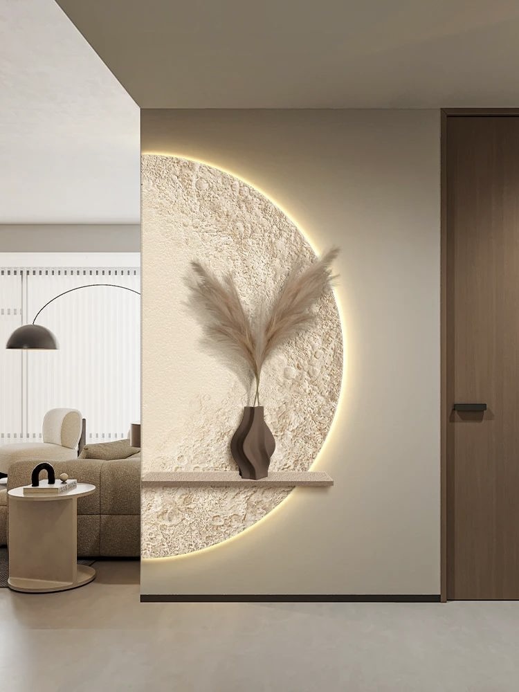 玄關處有大型半圓設計，以表面凹凸以及邊緣燈光設計，像半個月亮掛在牆上